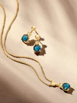 Oorstekers geelgoud london blue topaas + cadeau